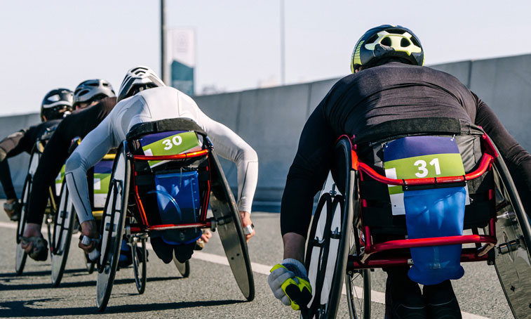 close-up group para athlete in wheelchair racing marathon race, sports summer games para athletics