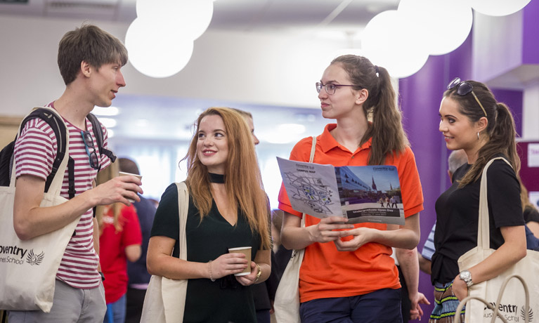 Students talking together at an event