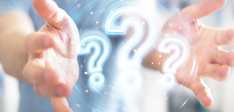 pair of hands with graphic question marks between