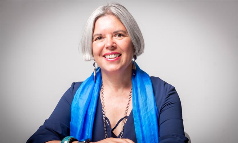 A head and shoulders image of Professor Elena Gaura smiling at the camera