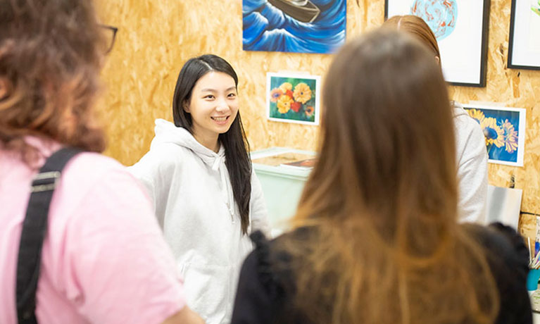 Apprentice smiling standing in a design studio