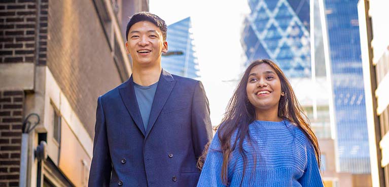 Two students walking on a London street 