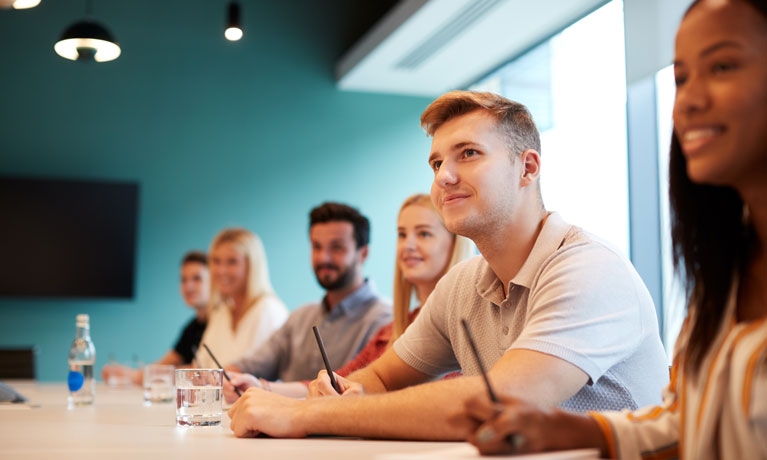 A group of people in a conference room