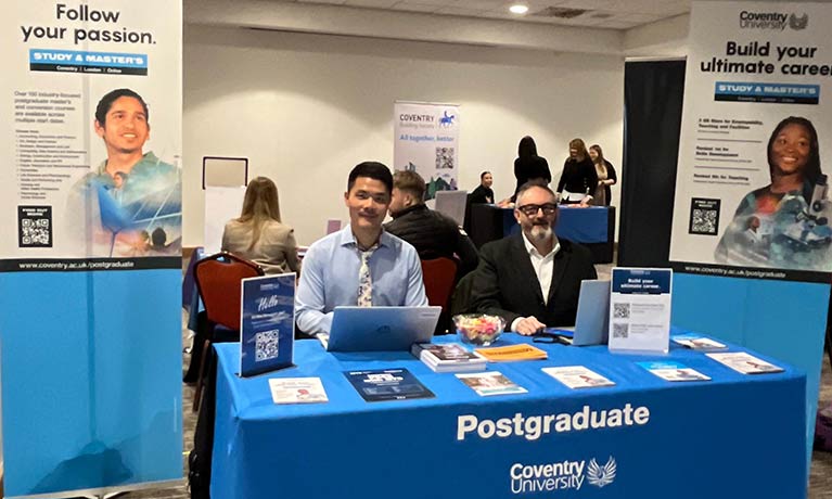 PG recruitment team at a stand