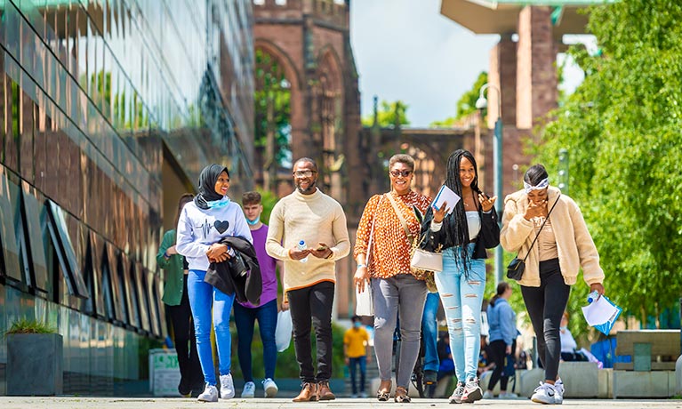 Group of open day visitors going through the campus 