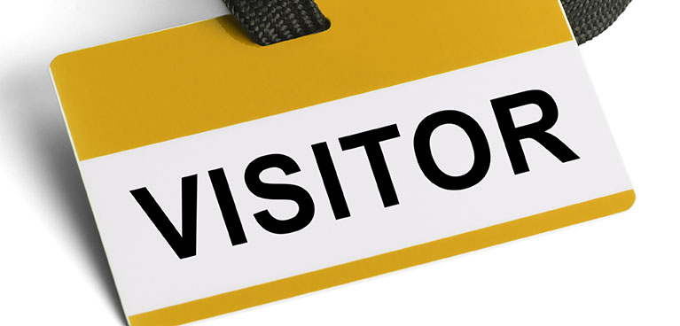 A visitor ID badge