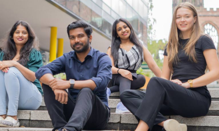 Students sitting together for a photo
